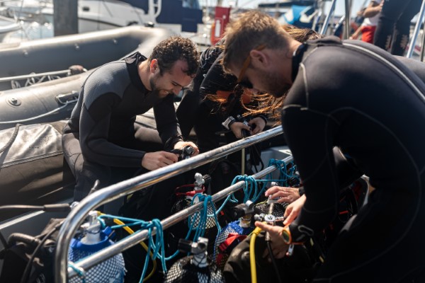 Divers preparing equipment